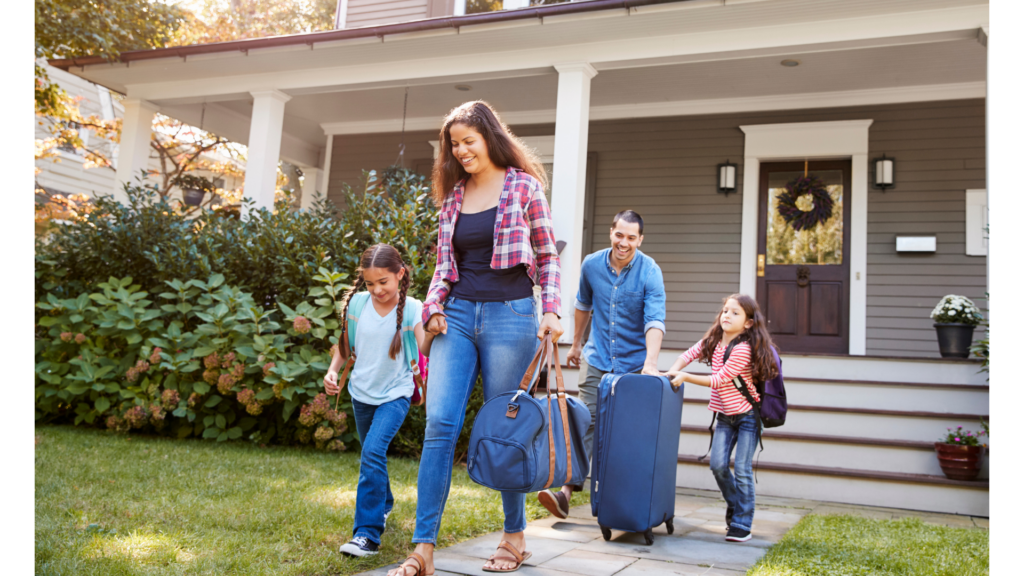 Family of four with luggage excited for their Florida vacation