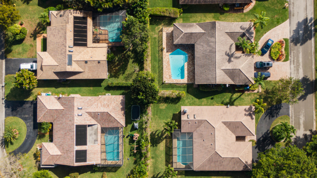 Aerial view of a Florida vacation home rental community with backyard pools